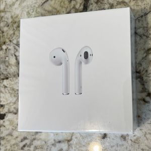Apple AirPods with charging case. Brand new.